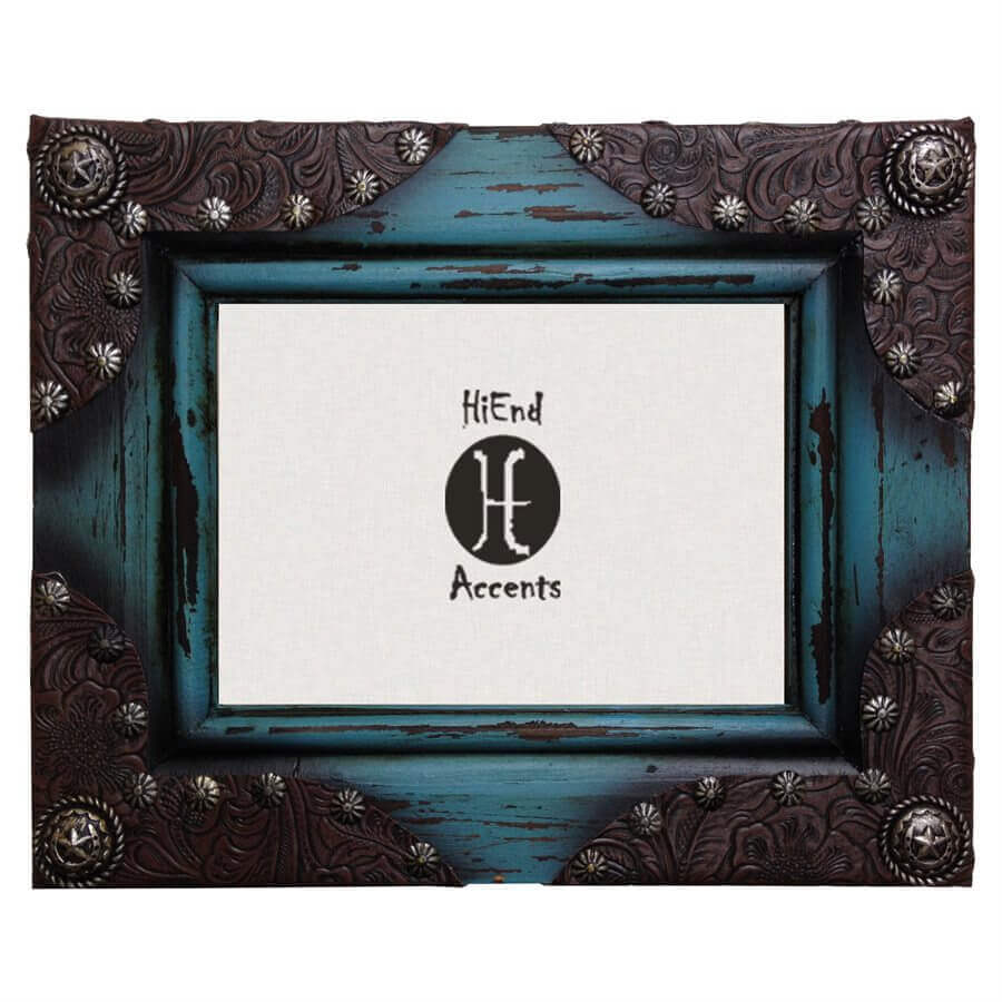 Turquoise painted and distressed wooden photo frame with tooled leather corners and silver Concho details adds a touch of western flair to your home. For photographs measuring 5" x 7". Can be utilized with either vertical or horizontal photographs. Back has swing tabs for easy installation, and a thick layer of glass protects your image.