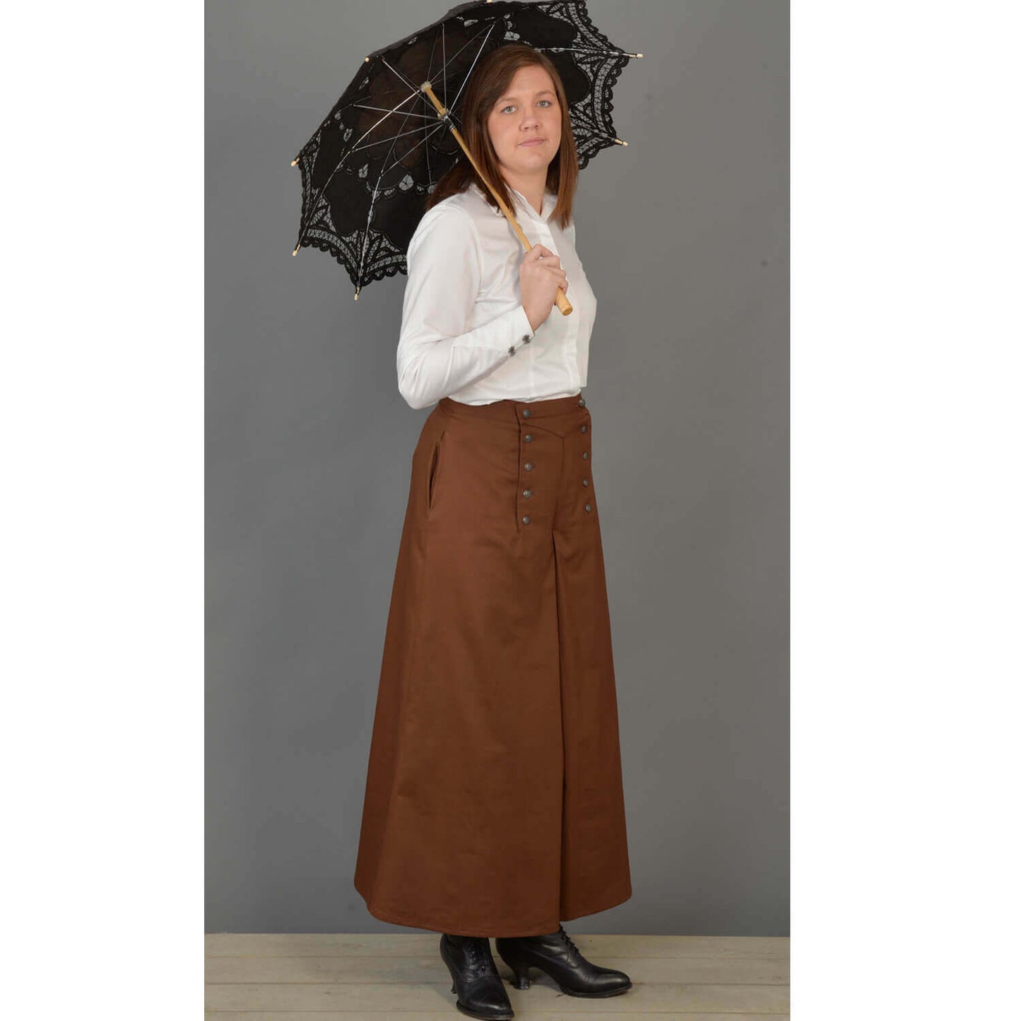 This split riding skirt design is our version of the popular riding skirt of the 1800’s. Cut with a slight flair, side pockets and front flap opening, this skirt allows ample movement for riding or walking. Victorian style buttons highlight the design and match the riding vest