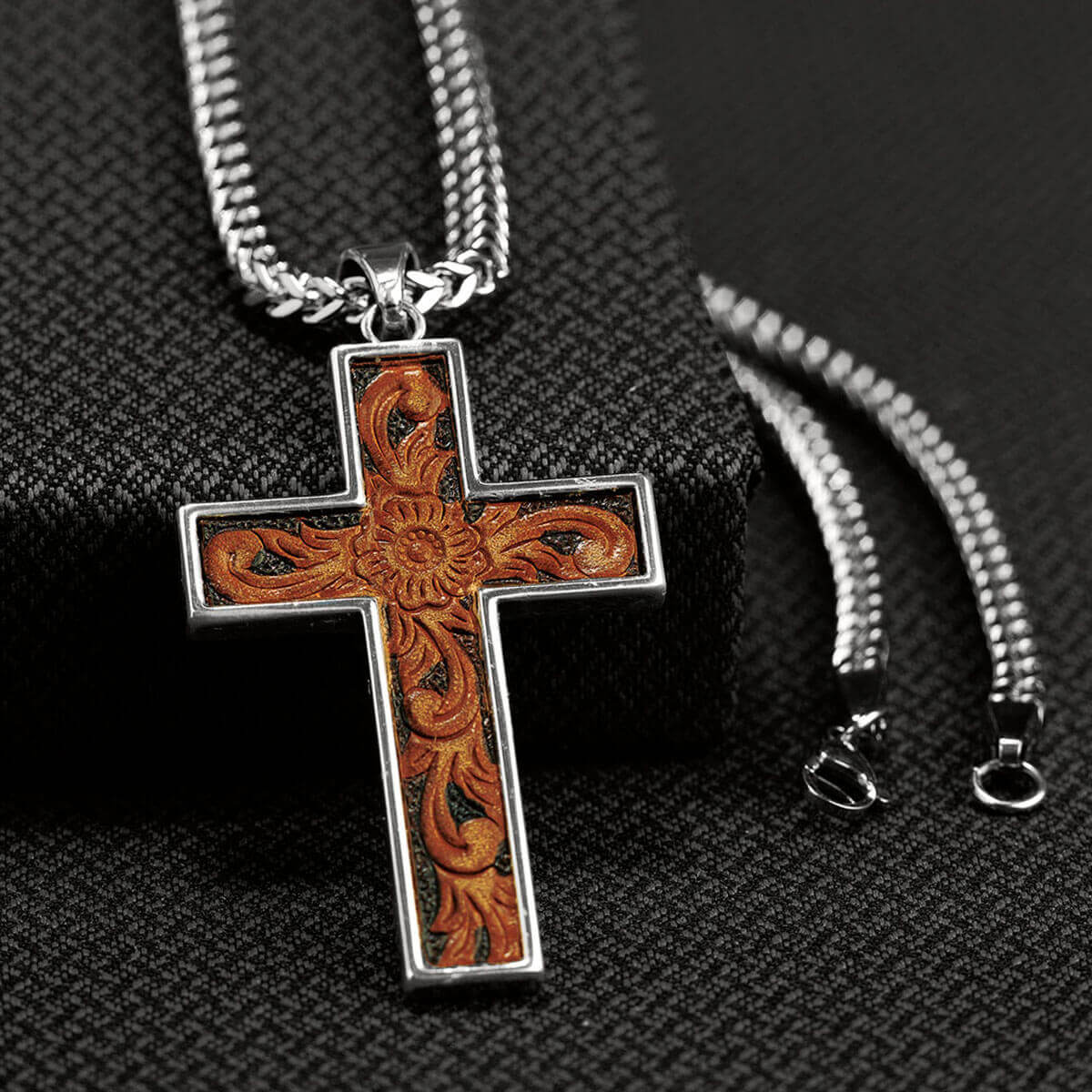 This chain necklace has a very edgy look. The chain is a small Franco style with a leather inlay cross. 24" long. Imported