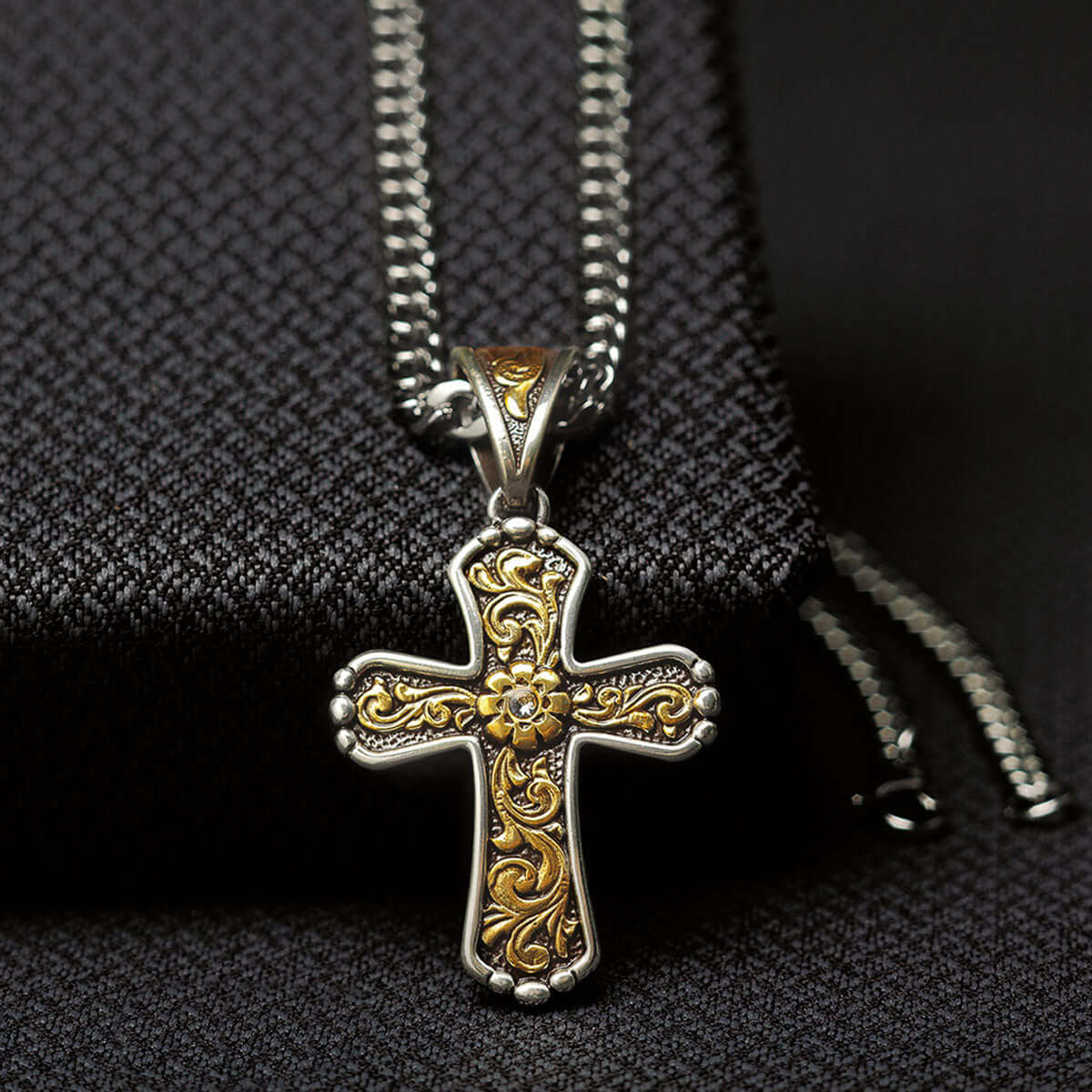 This Twister men's chain necklace features an antique gold floral scroll design on an antique silver cross.  22" long.