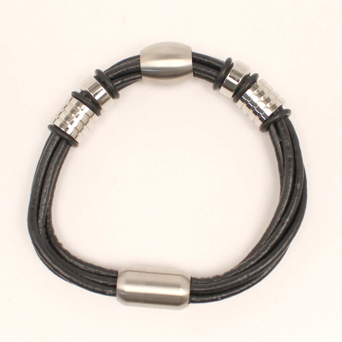 This men's western bracelet is very masculine. There are 5 genuine leather strands with metal ornaments. Magnet closure.