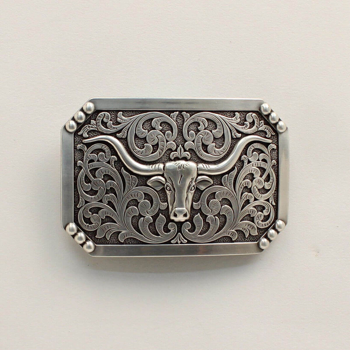 <span data-mce-fragment="1">This western belt buckle features a smooth edge with dot corners. The center has a longhorn motif with western scrolling in the background. Measures </span><span lang="EN-US" data-mce-fragment="1">3-3/4 x 2-1/2 and fits a 1-1/2" belt.</span>