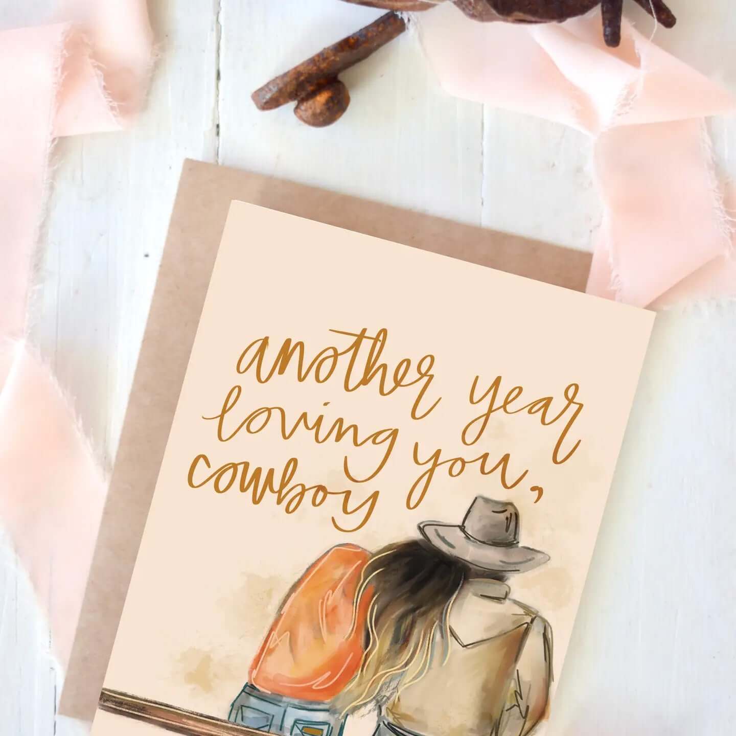 Cowgirl & Cowboy Western Greeting Cards Blank featuring a couple with the text 'another year loving you, cowboy'.