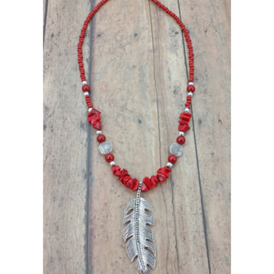 Bamboo coral chips carefully stranded make this gorgeous necklace standout and a silver tone feather pendant hangs down giving it that spiritual western feel. Handcrafted in the Black Hills, SD. Necklace measures 16-20ā³. Feather pendant is approximately 2" long.