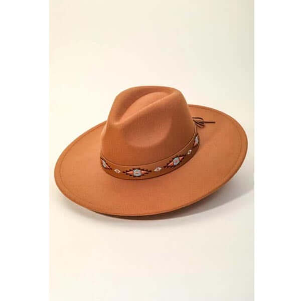 A must have trending fedora hat created with a Boho tribal pattern strap fedora hat design. A perfect gift for the upcoming season. Adjustable inner string.