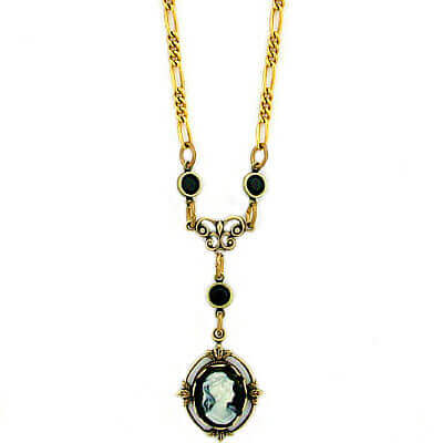 Our antique reproduction vintage style cameo jewelry gives you a real heirloom look and feel at a great price! The faux cameo is set in an antiqued natural brass flower frame. The antique gold plated Figaro link necklace chain measures 16”. The connectors are antiqued natural brass with Swarovski Austrian crystals. Earrings Sold Separately. Made in USA.