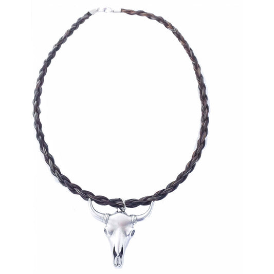 Horse hair with a modern twist! This neckwear features a metal skull pendant, solid black tone spiral braid of horse hair-finished with metal end caps and a lobster claw closure. 18 inches long.