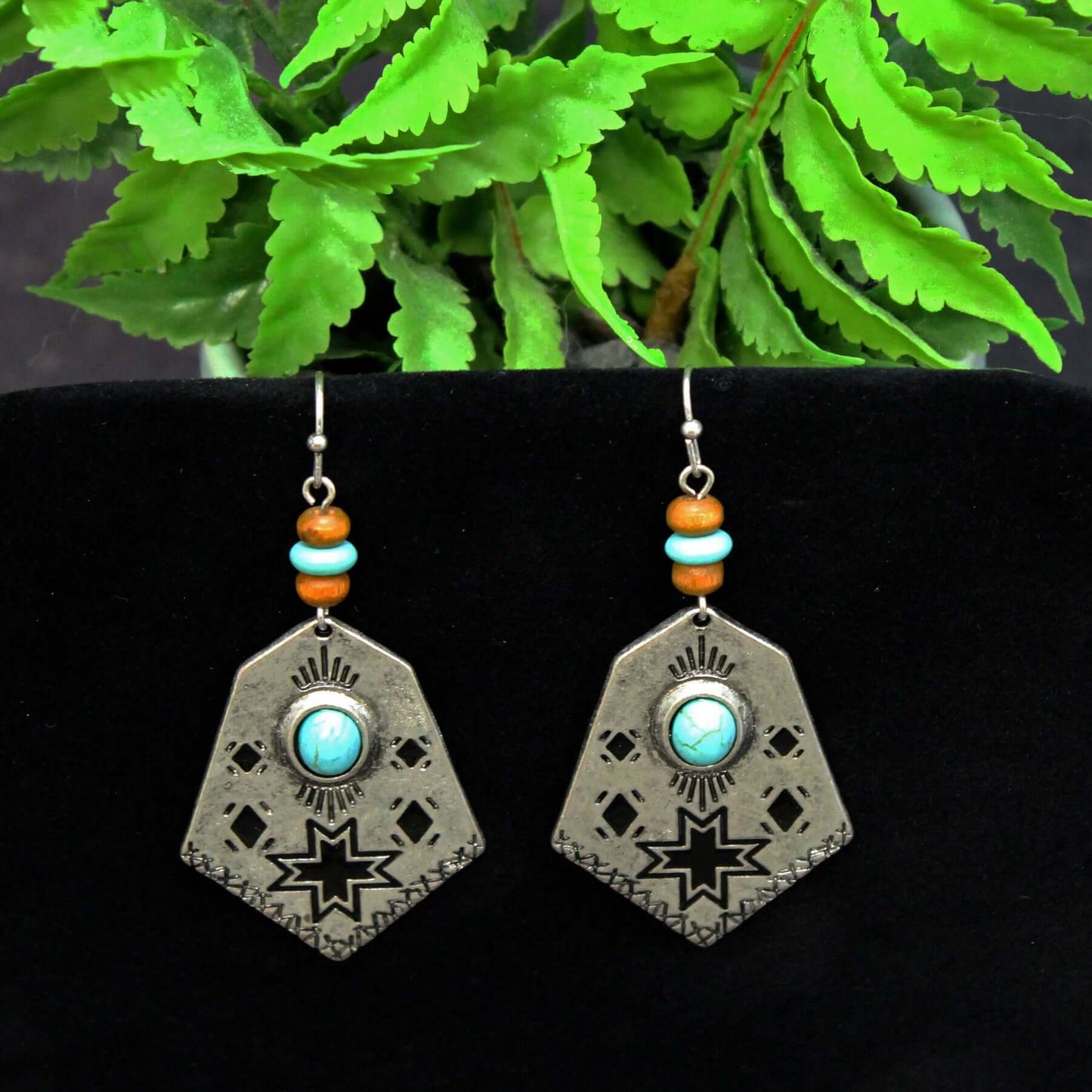 Embrace your adventurous spirit and let these Cowgirl Adventure Earrings transport you to the wide-open landscapes of the American West. Whether you're headed to a music festival, a night out with friends, or just running errands, these earrings will add an effortless touch of style and flair to any outfit. Prepare to turn heads and start conversations wherever your cowgirl adventures take you. Measure 2-1/2" long and 1-1/8" at widest point.