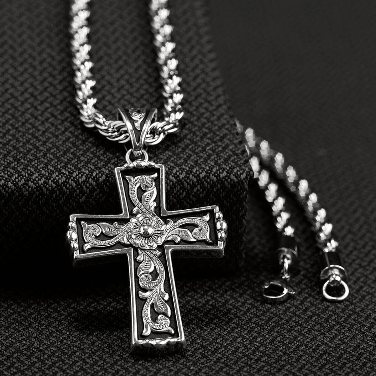 This men's cross chain necklace has a very edgy look. The chain is a small rope style with a 3 dimensional silver cross. Western Cross Necklace 24" long.