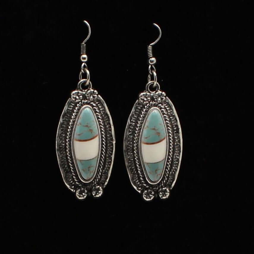 Antique silver setting with turquoise and ivory marbled stone in the center. French hook style. Ladies Western style earrings with silver and turquoise.