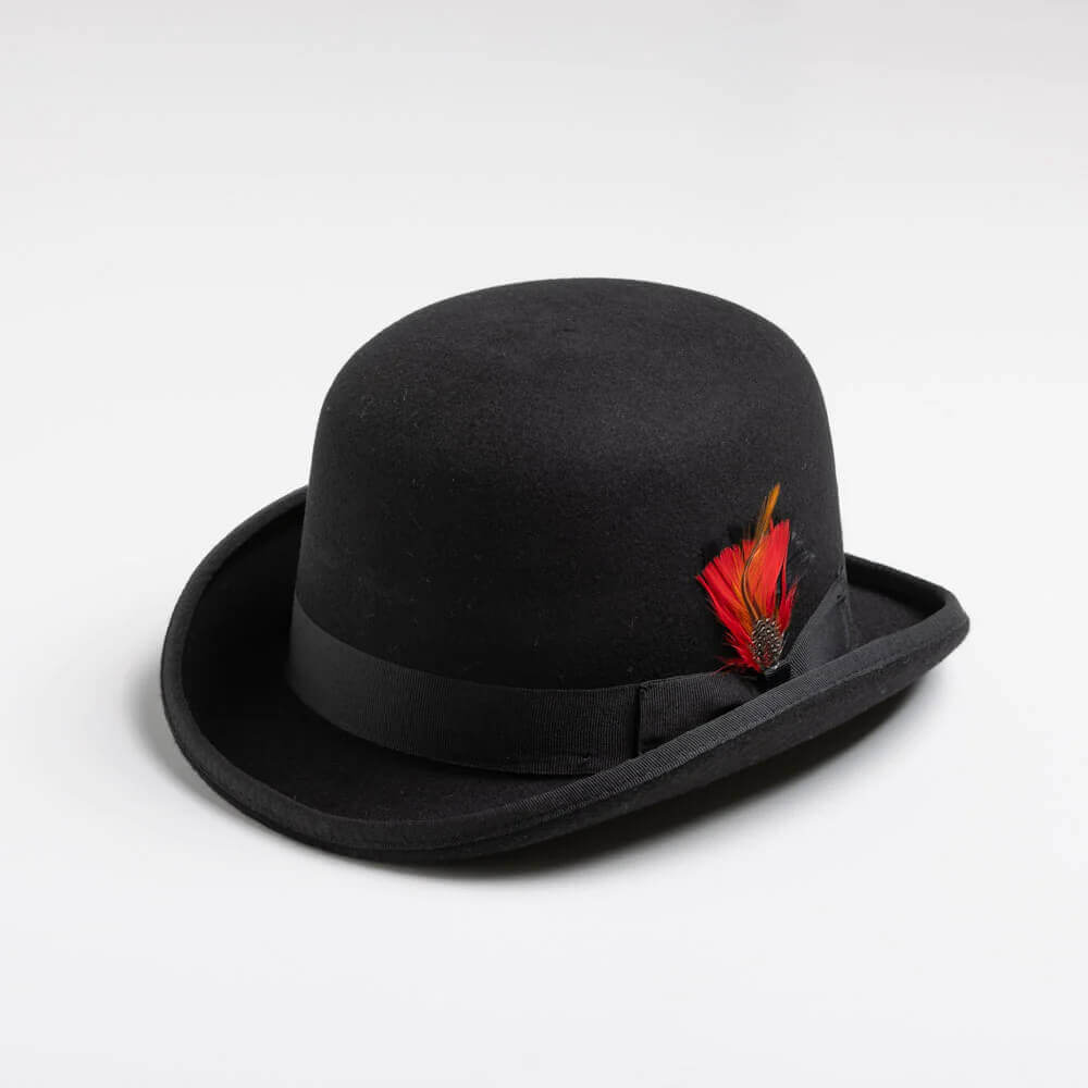 The derby hat has been popular for the past century and a half and is one of the most recognized styles of hats in history. Comes in black wool felt with red and yellow feathers tucked into the gross grain ribbon along a 2 1/8” brim. Made in the USA.