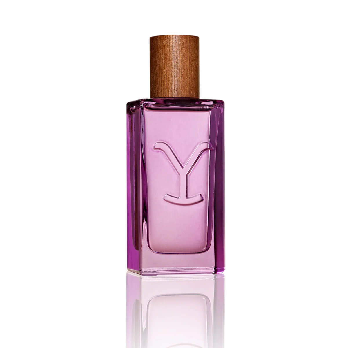 Pink perfume bottle with wooden cap on a white background