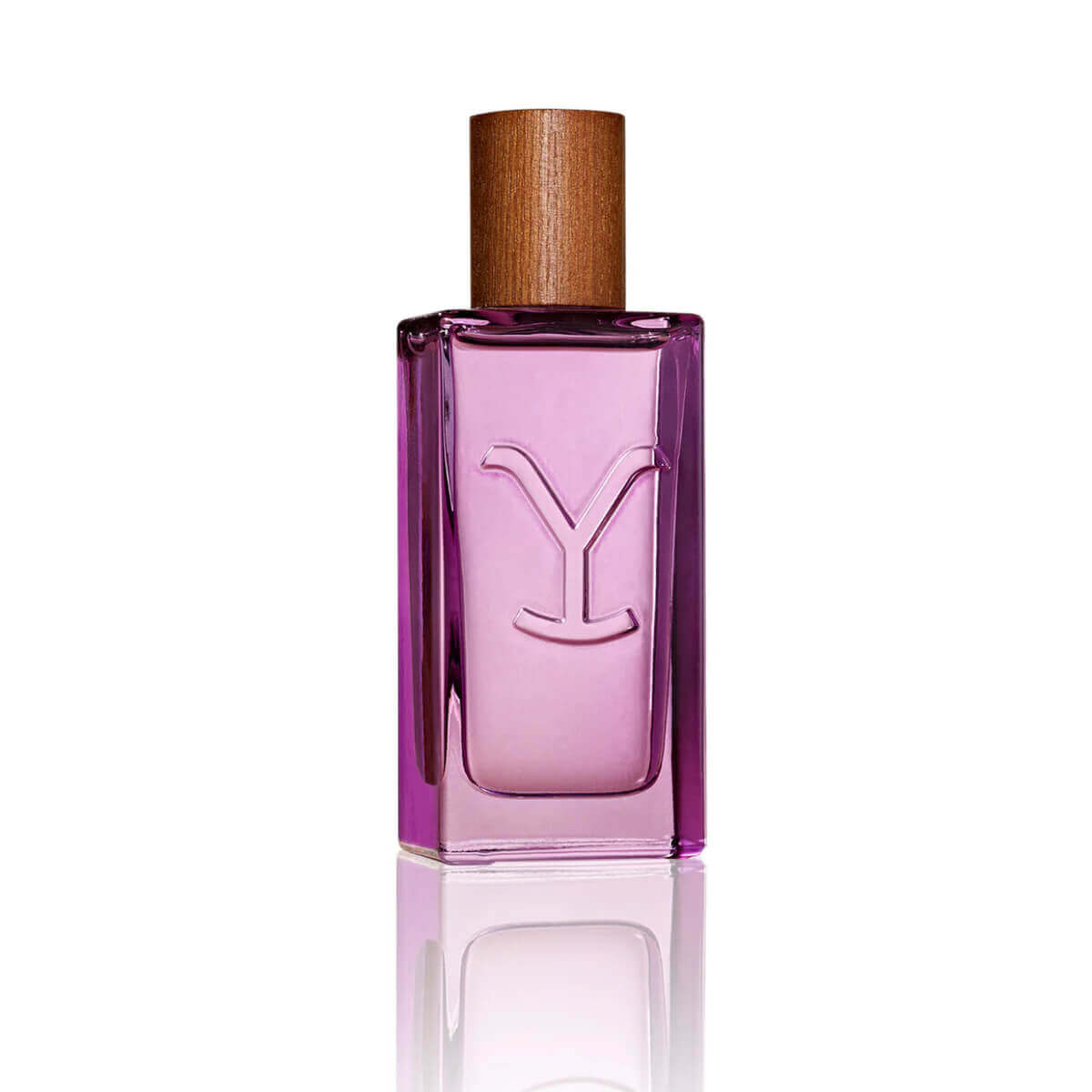 Pink perfume bottle with wooden cap on a white background