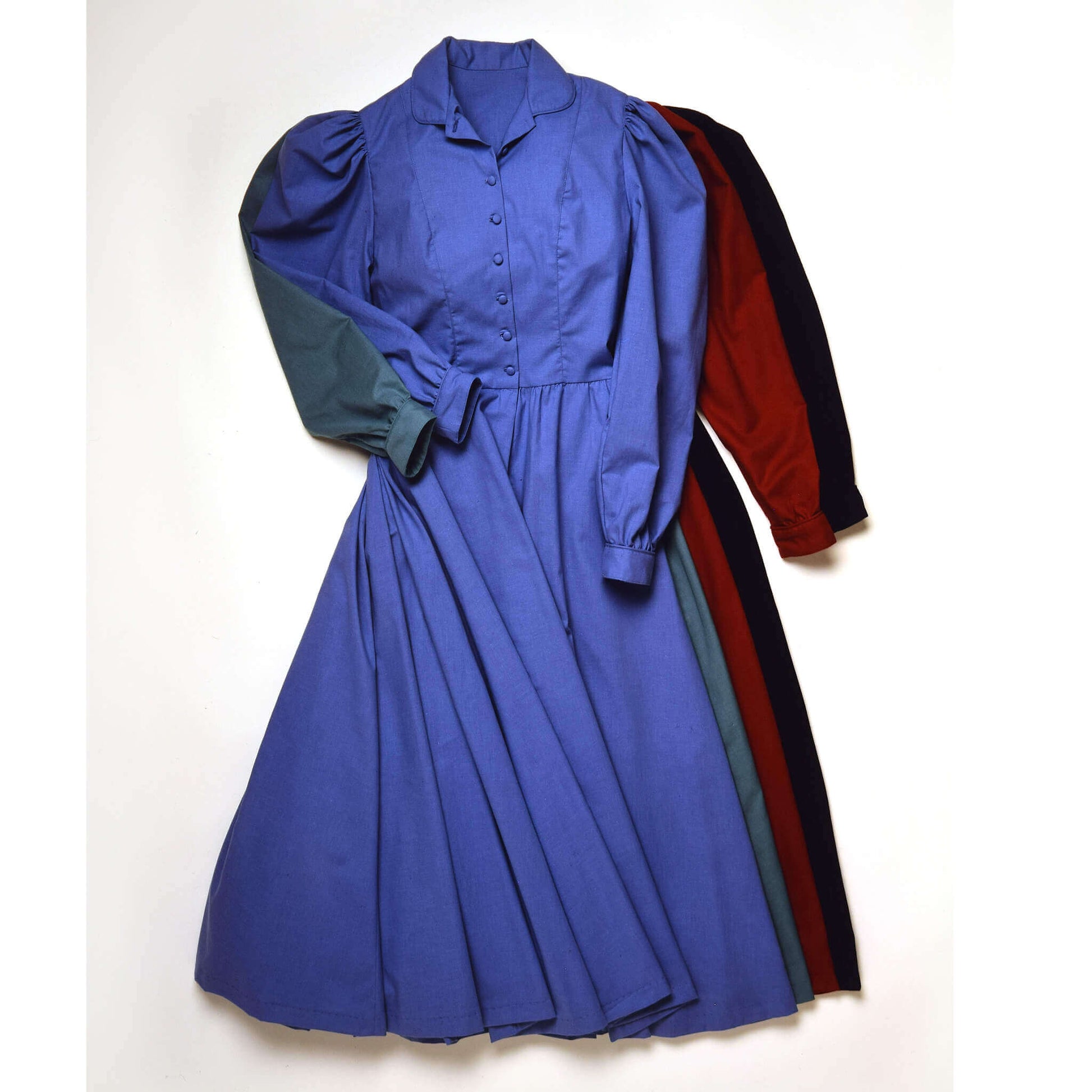 Old West Farmstead Dress in blue with button-down front and puffed sleeves, showcasing a casual farm style.