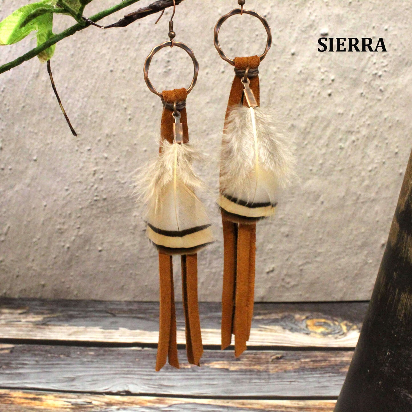 Feather and Leather Tassel Western Earrings featuring deer skin leather and feathers, elegant design and copper hoops.