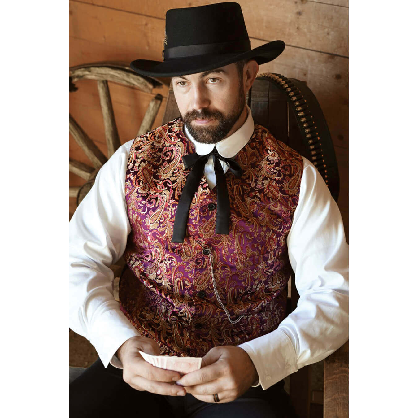 Classy western brocade vests like this were seen in saloons and riverboats years ago and makes a great vest for the holidays or that special event nowadays. The vest has one top left welt pocket and two bottom welt pockets. This simple style vest has black matte satin polyester back and an adjustable belt for a perfect fitted look. Great for Weddings!