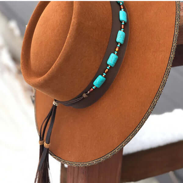 Wild and Free. This chunky turquoise howlite hatband is accented with rust seed beads and copper freshwater pearls. Finished with sunburst Conchos, leather ties and Authentic Horse Hair tassels. Punchy. One size fits most hats.