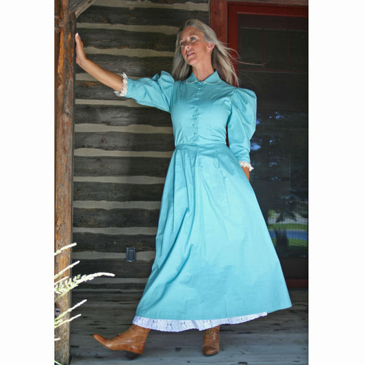 Frontier Homestead Dress in teal color, featuring lace-trimmed sleeves and a full skirt, styled for rustic elegance.