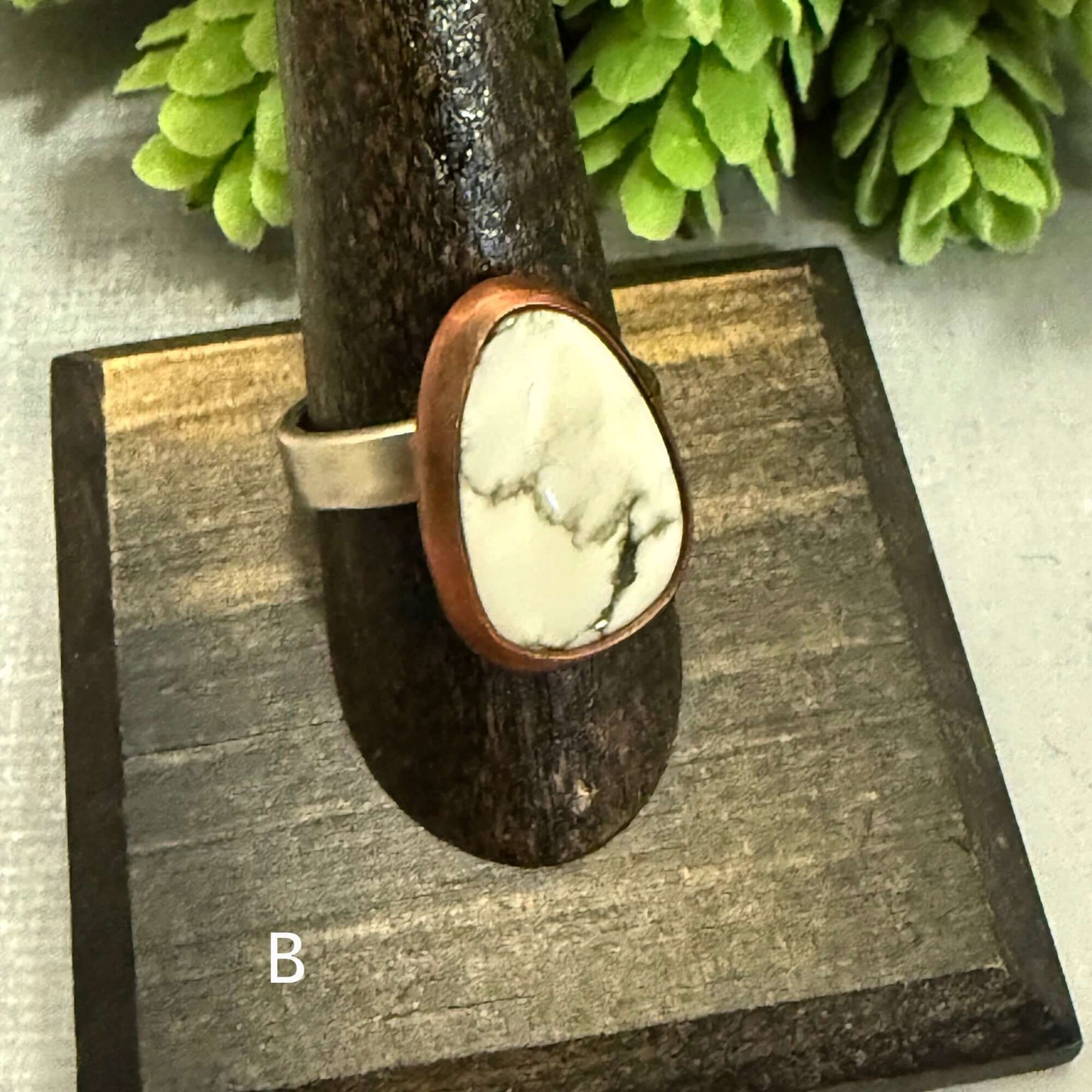 Handmade J Marie Genuine Turquoise Ring on display, featuring a unique stone set in an adjustable band.