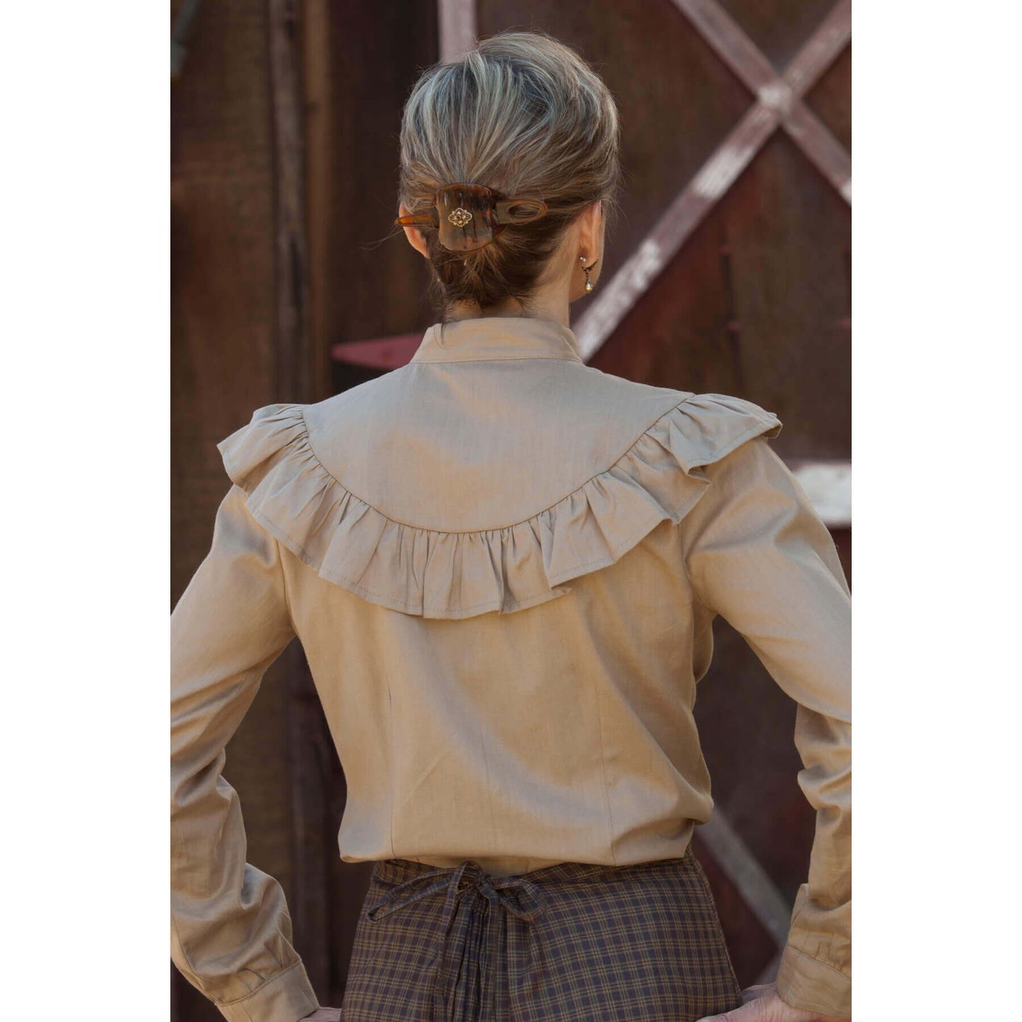 Back view of Kate's Prairie Blouse with ruffles in golden tan color, showcasing vintage-inspired design.