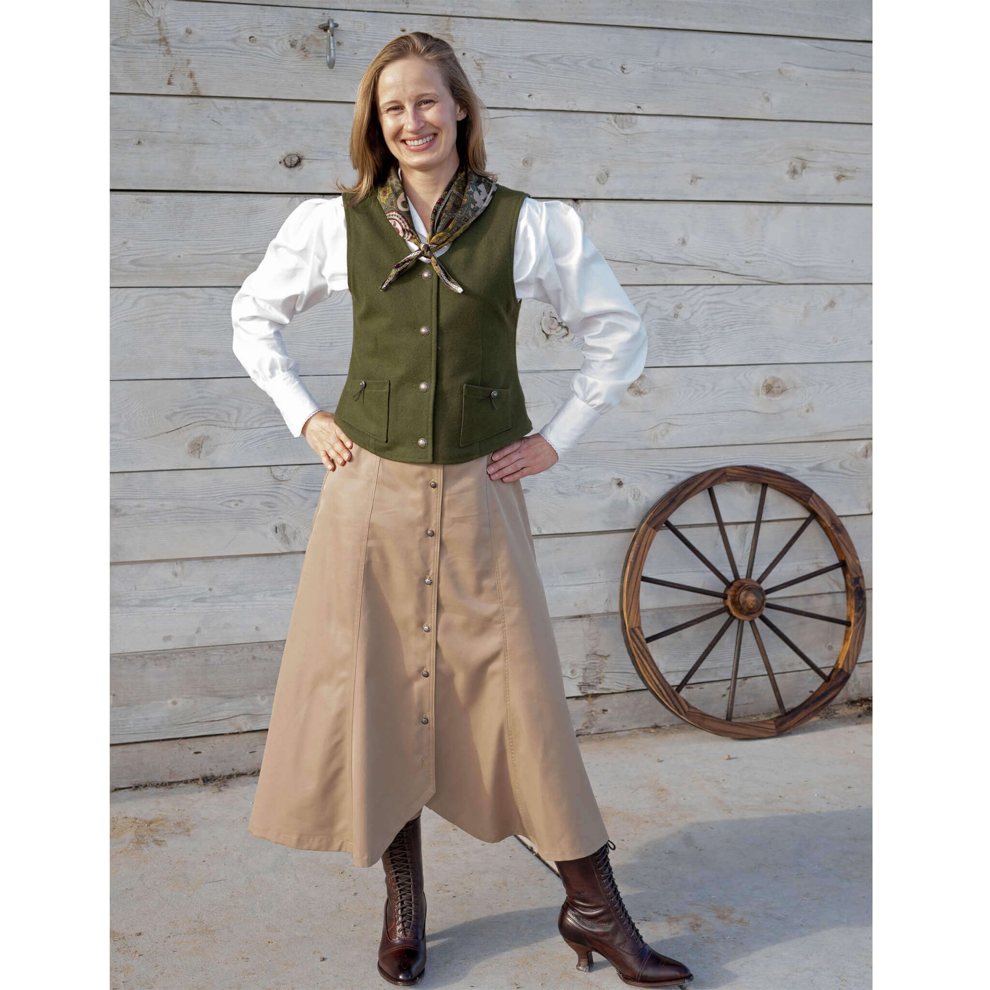 Whether you are running an errand to the local mercantile or need a perfect look for the next barn dance, the Maybelle Gore Skirt can appropriately dress you for all occasions. Great for the busy cowgirl’s life while keeping her comfortable and feeling good. Six gores flow as you walk and curve up in the front to feature your boots. Buttons down the front with antiqued nickel Conchos. 100% Microfiber Polyester.  Made in USA.