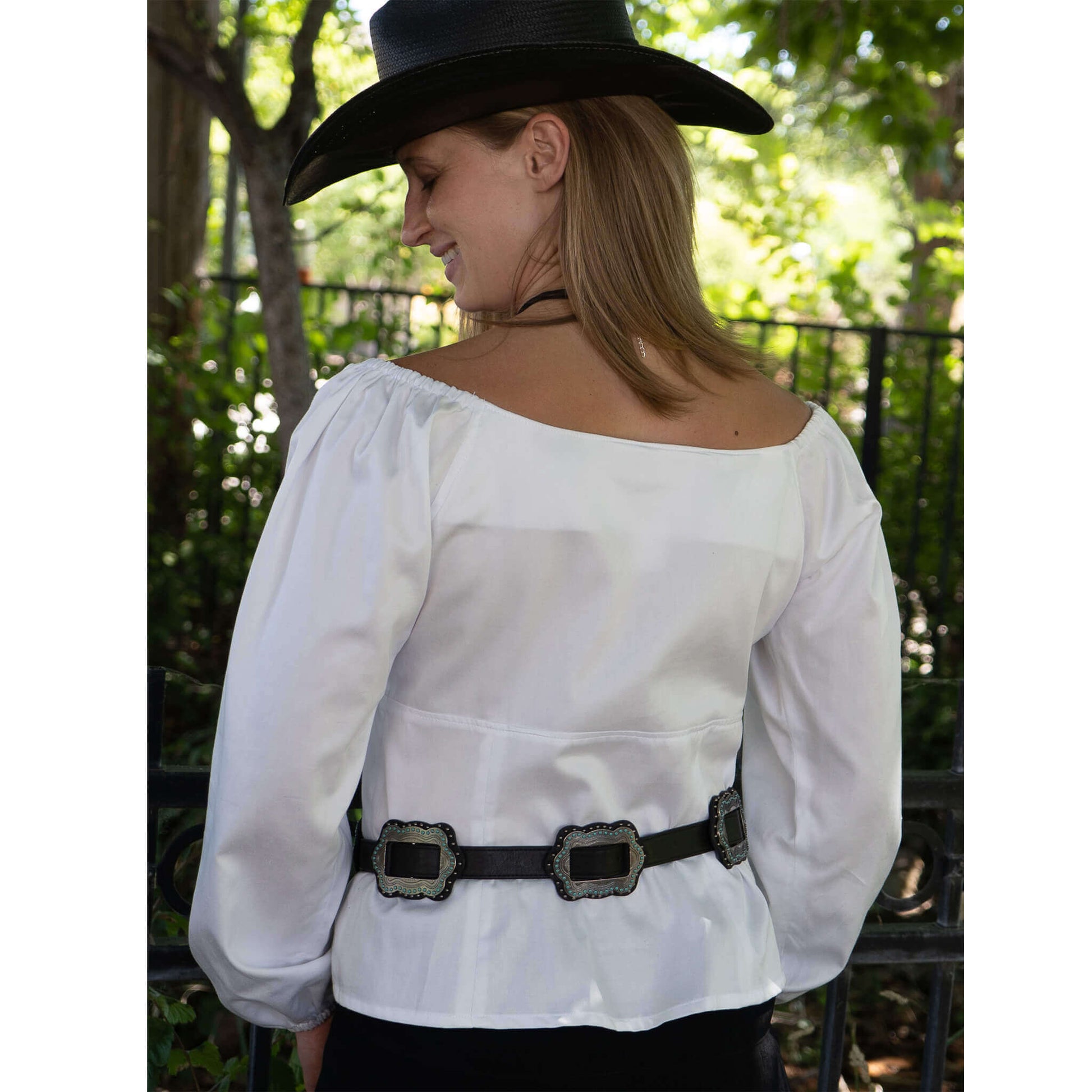 Model wearing the Mesa Cowgirl Western Blouse with off-shoulder sleeves, showcasing a sweetheart neckline and stylish belt.