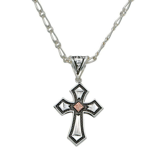 A tiny but intricately designed cross featuring a copper diamond square in the center of a bright silver cross, outlined with darkly antiqued stippling. Hung from an antiqued filigree bale on a 18" figaro chain. Cross pendant measures approximately 1" wide by 2" long.