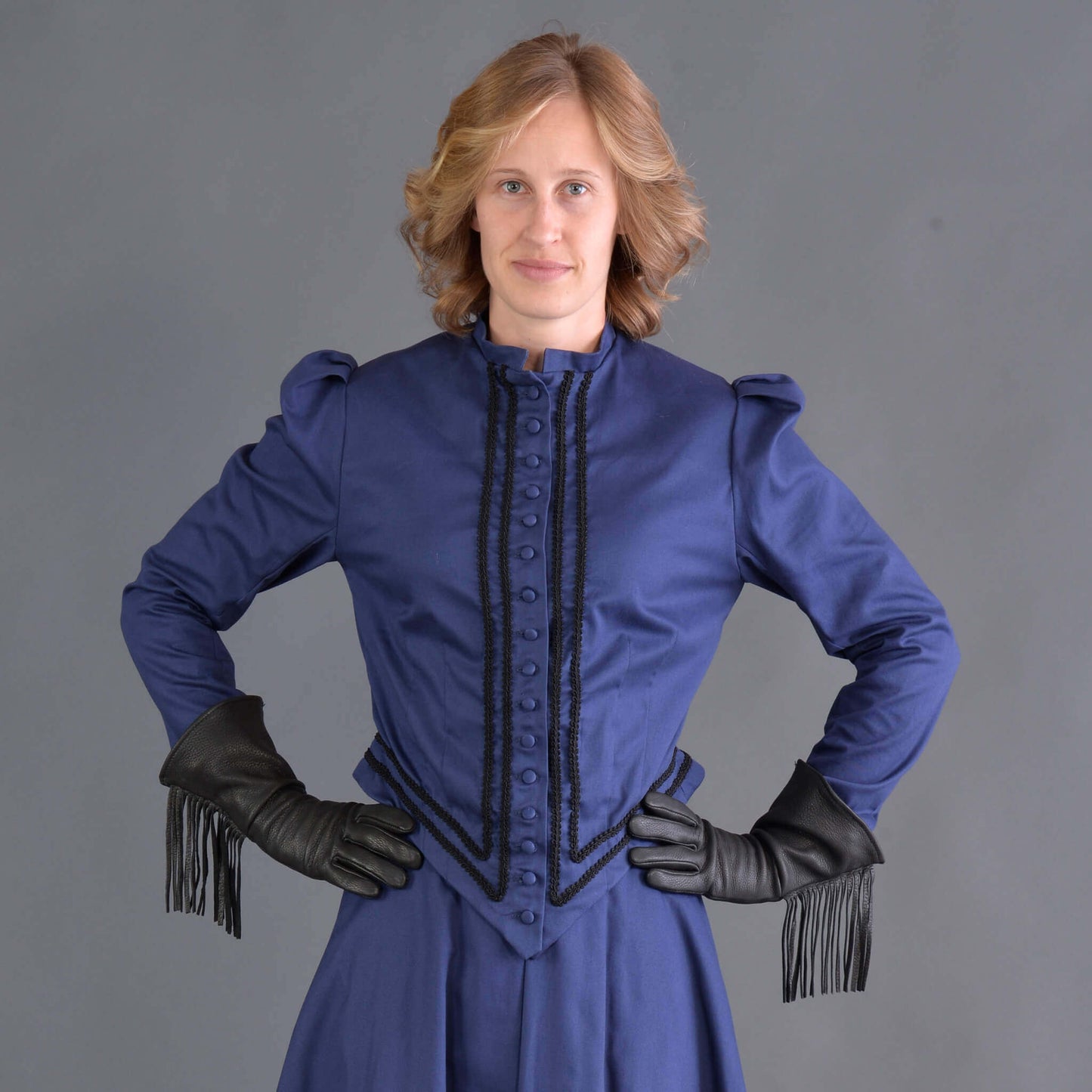 Designed for the horsewoman, this classically tailored Riding Jacket looks handsome with or without the horse. The jacket is very fitted with soutache trim and fabric covered buttons. This jacket and our riding skirt together makes a wonderful combination of tailored fit and comfort so if you ride a horse or just want to look like you do, this is the outfit.