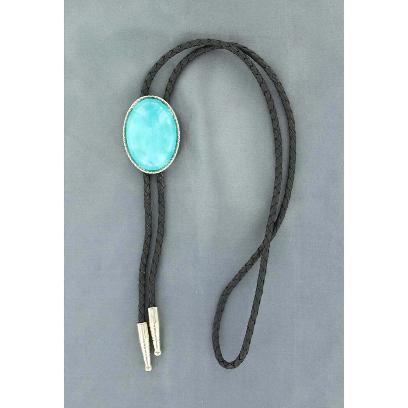 For a distinctly Southwestern look during formal occasions, you'll like this oval-shaped turquoise bolo tie. The slide contains a rope-like edge around an oval turquoise stone. The tie itself is made with braided black leather. Imported 36" Long
