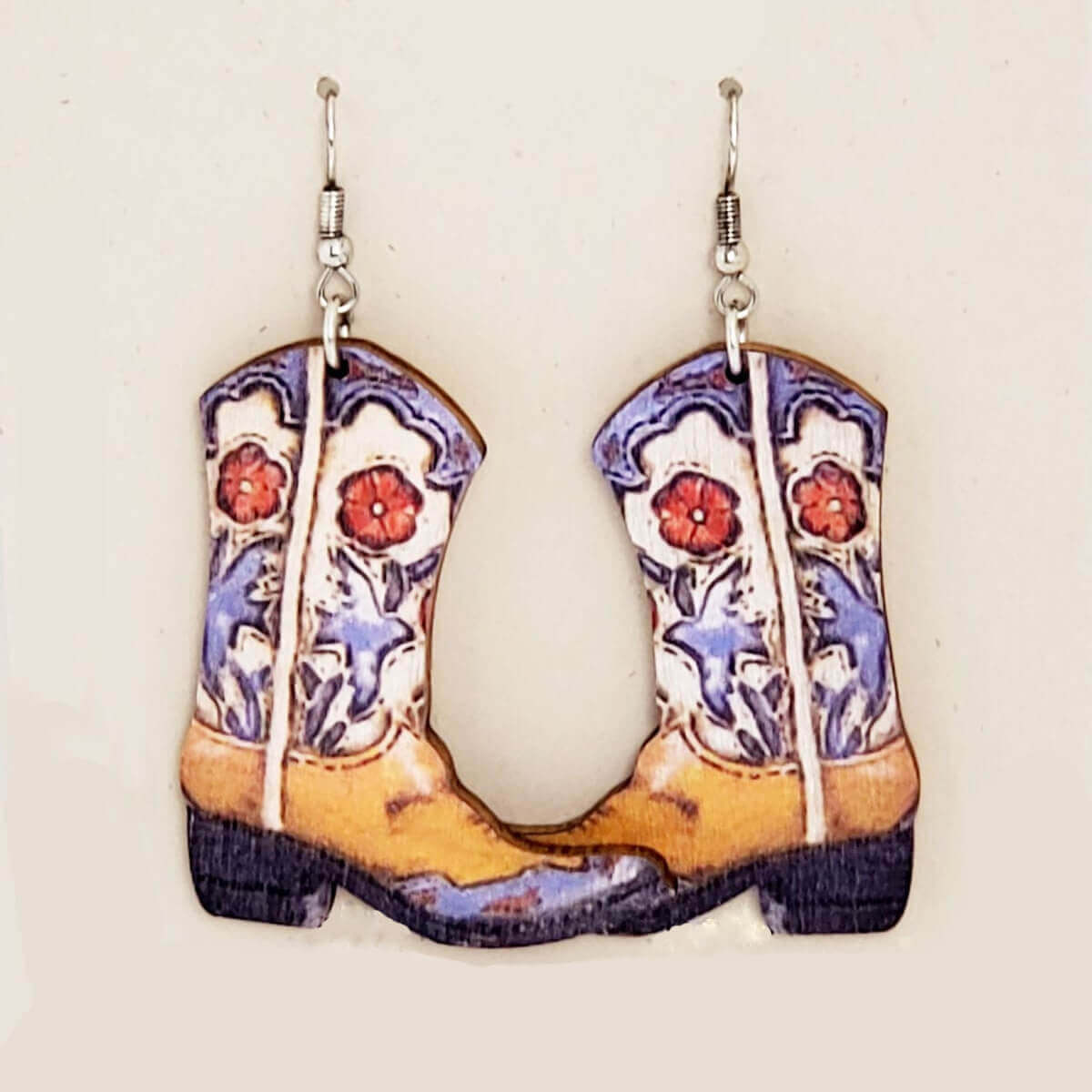 The light weight wooden pair of boots measure 2 inches long from the hypo-allergenic ear wire to the bottom of these earrings and the widest part measures 1 1/2 inches. Sassafras is how I would describe this pair!