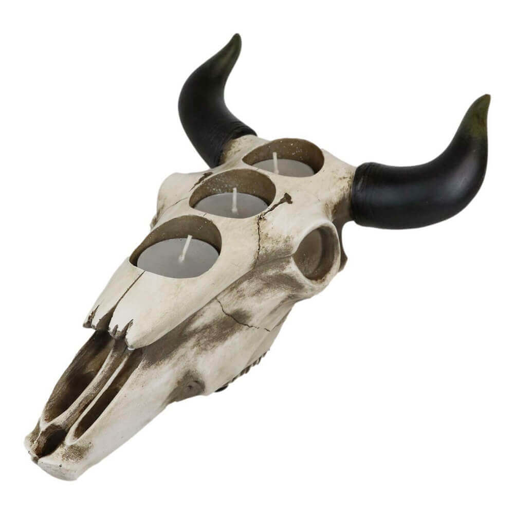 <span>This Southwestern Bull Cow Skull Votive Candle Holder is made of the highest quality resin, hand painted and polished individually. </span><span>It features the texture and detail of an actual skull and its horns. Perfect for a southwestern, western, farmhouse or cowboy decor. Place on a heat-resistant surface and burn your favorite votive candles to express your own unique style. The skull holds up to 3 votive candles</span>