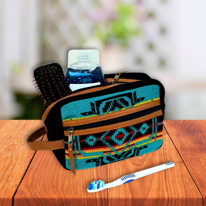 These vibrant Southwest Travel Pouches with brightly woven acrylic in bold Southwest patterns combine eye-catching patterns with functionality. Now upgraded with durable vegan leather reinforcement, sturdy zipper pulls, and a convenient side strap, main zippered compartment and exterior zippered pocket, perfect for travel, cosmetics, accessories, and more. Fully lined for easy cleaning. Approx. 6” H x 9” W x 4”