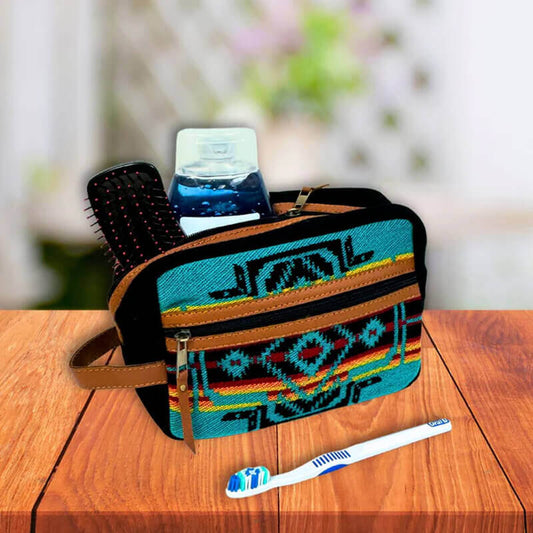 These vibrant Southwest Travel Pouches with brightly woven acrylic in bold Southwest patterns combine eye-catching patterns with functionality. Now upgraded with durable vegan leather reinforcement, sturdy zipper pulls, and a convenient side strap, main zippered compartment and exterior zippered pocket, perfect for travel, cosmetics, accessories, and more. Fully lined for easy cleaning. Approx. 6” H x 9” W x 4”