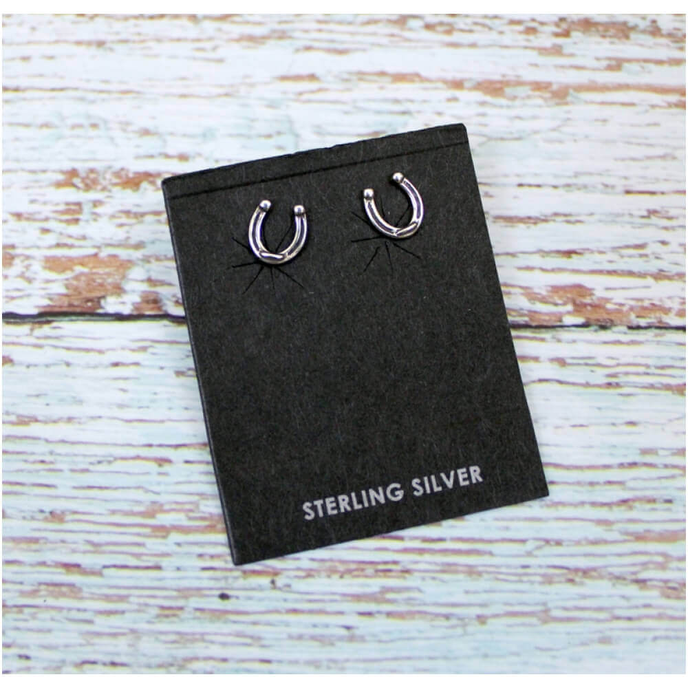 These adorable dainty horsehoe earrings are the perfect size. Made of sterling silver and make a great everyday wear. Made in USA. Measure about 3/8"