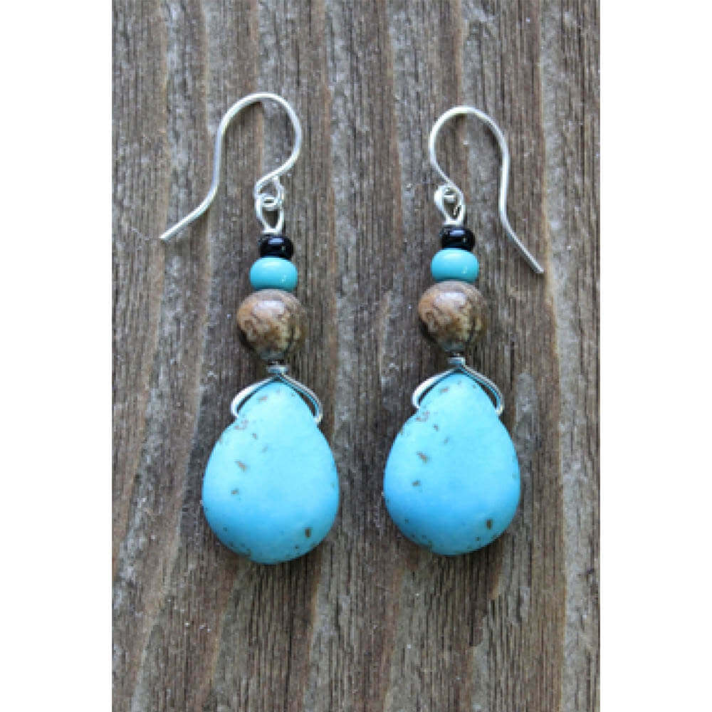 Magnesite turquoise & jasper earrings are handcrafted by artisans in the Black Hills of South Dakota. Magnesite helps uncover thoughts & feelings that are no longer self serving and promotes unconditional love. Our ear wires are hypo-allergenic for sensitive ears.