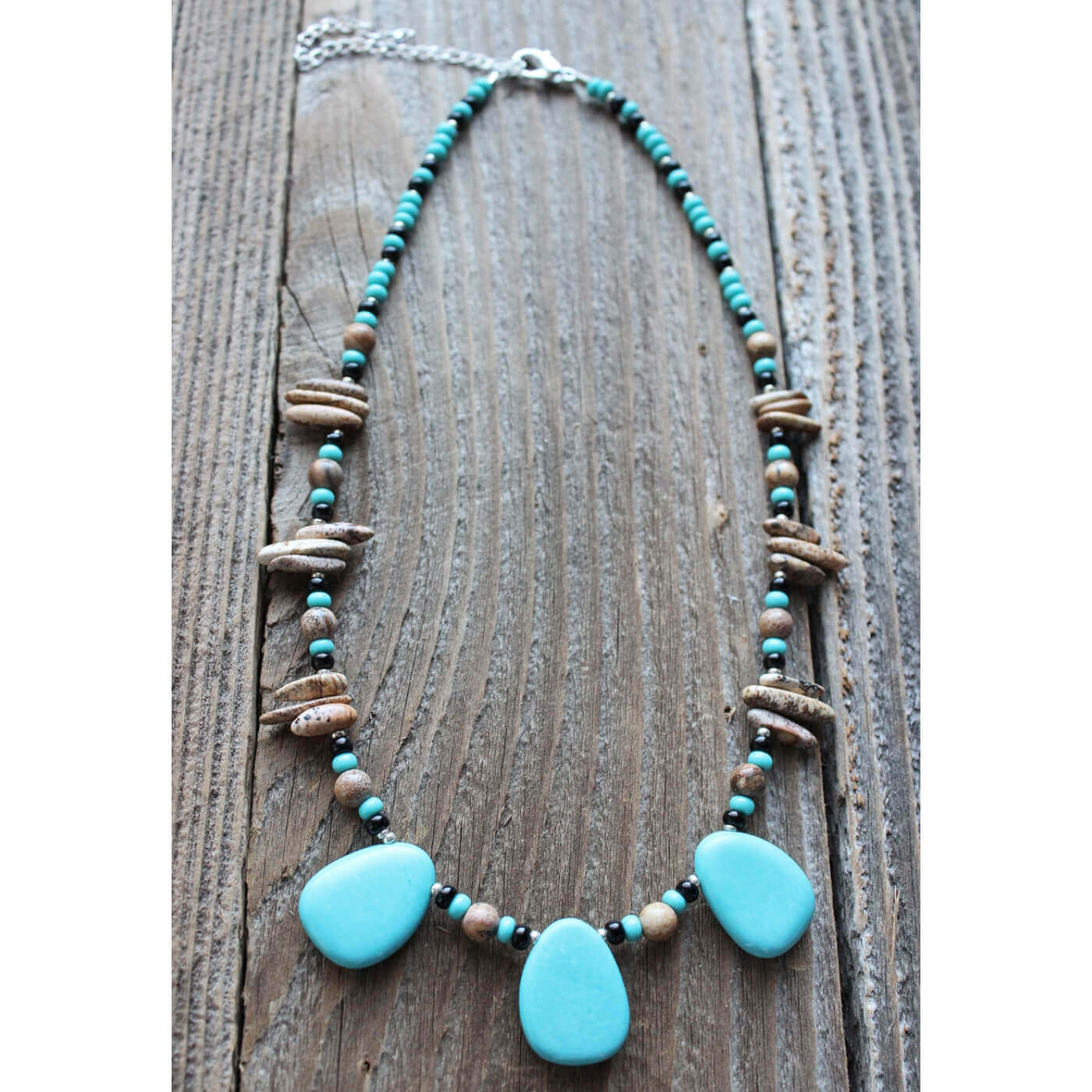 The semi-precious stone “magnesite” enhanced with turquoise, helps break the bonds of dependency and uncovers thoughts & feelings that are no longer self serving. The necklace measures 16-20″ this striking piece is natural and unique. Matching earrings sold separately.