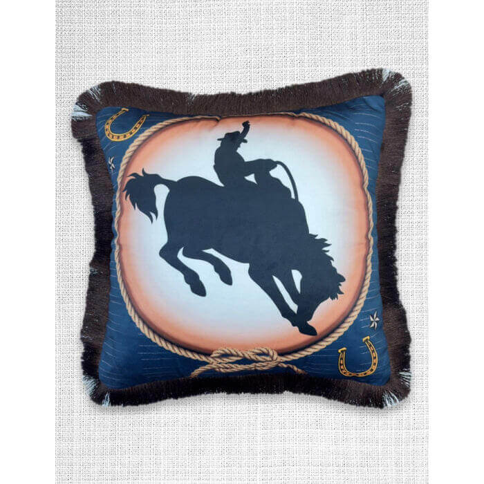 Decorative pillow with a horse and rider silhouette design on a blue background.