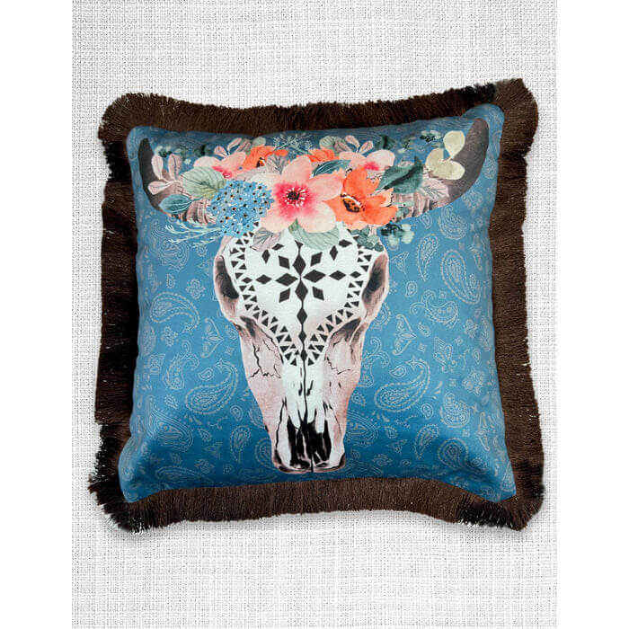 This Velveteen Fringed Pillow brings rustic charm and elegance to any space with its floral-adorned cow skull design on a paisley background. Crafted from soft velveteen fabric for a luxurious feel. Fringed edges add a decorative, rustic touch. Features a color-coordinated zipper closure on the back for convenience. Approximate size: 18" x 18"
