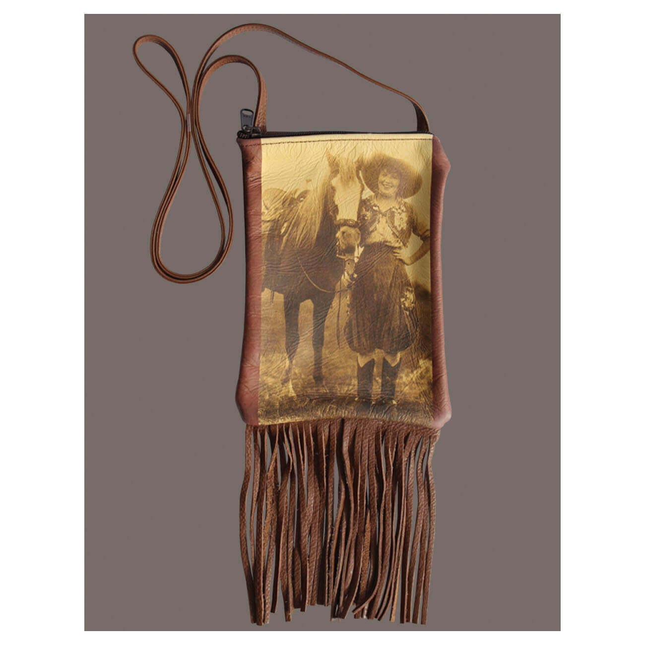 Every Cowgirl needs a cool purse. This bag feature vintage photo of Prairie Rose and horse on soft leather purses with a long strap and fringe. Measures 6”W X 9”L.
