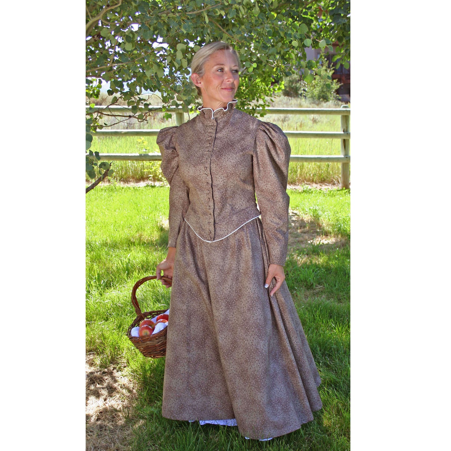 You can wear this finely made walking skirt and jacket almost anywhere. Skirt has two side pockets and is fully gathered in back for a bustle effect. The fitted jacket is detailed with cream piping. Skirt is frontier length, approximately 35" long. Wear it with our petticoat sold separately. Offered in navy, brown or moss. Made of 100% Cotton. Made in USA.