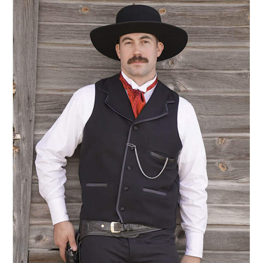 Similar to the vest worn by Kurt Russell as Wyatt Earp in “Tombstone”, this iconic style vest will help you walk the street in confidence. Notched lapels are sewn into the shoulder seam and trimmed in satin bias with three matching satin welt pockets and back belt. Made of 100% wool and lined in polyester. Dry Clean. Made in USA.