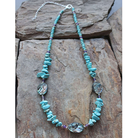 <span data-mce-fragment="1">This piece really is prettier in person. The colors of the stones all compliment each other well and have special meanings. Abalone promotes the power of imagination and Amethyst is the stone of awareness. Necklace measures 16-20ā³ and h</span><span data-mce-fragment="1">andcrafted by local artisans from the Black Hills in South Dakota. Matching Earrings Available</span>