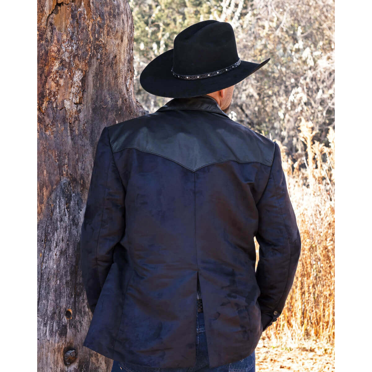 This western Blazer is our latest design in men’s western formal wear. The Blazer is made with buttery soft micro-suede fabric with contrasting genuine leather front and back yokes. The two front inset pockets have yokes accented with contrasting genuine leather for that classic western style. Blazer is fully lined and has an inside chest pocket with center back vent for easy movement. Pairs nicely with jeans or slacks. Dry Clean. Made in USA.