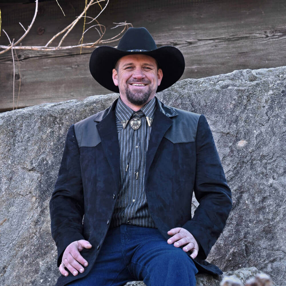 This western Blazer is our latest design in men’s western formal wear. The Blazer is made with buttery soft micro-suede fabric with contrasting genuine leather front and back yokes. The two front inset pockets have yokes accented with contrasting genuine leather for that classic western style. Blazer is fully lined and has an inside chest pocket with center back vent for easy movement. Pairs nicely with jeans or slacks. Dry Clean. Made in USA.