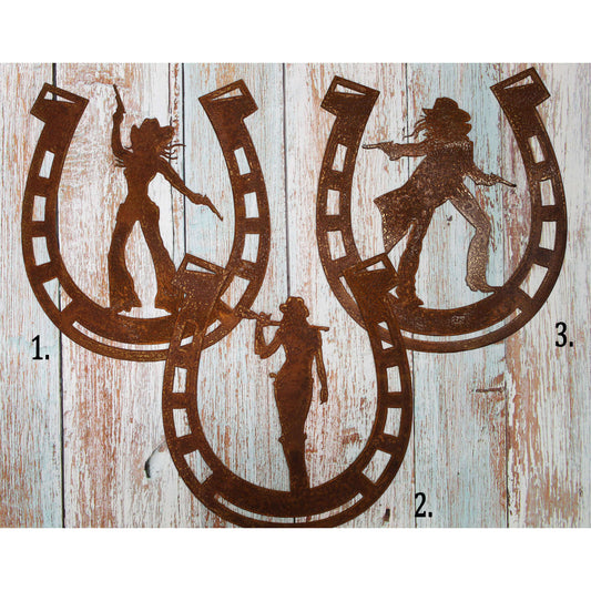 Rusted metal cut out in a horseshoe shape in three differnt cowgirl silhouettes and we call them Charlie's Cowgirls. Heavy Duty. Good for indoor or outdoor display in your home, barn, ranch or office. Measures about 11" wide by 12" tall. Made in Oregon.