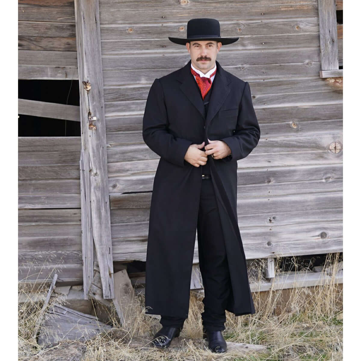 This is a long version of our Frock Coat reminiscent of the coat worn by Kurt Russell at the end of the film “Tombstone”. Cut long to ankle-length, features two front flap pockets, a chest welt pocket and an inside pocket. Made of a medium weight 100% Wool Flannel and lined in polyester. Made in the USA. Dry Clean. Made in USA.