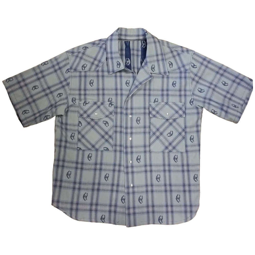 Stay stylish and cool in this short sleeve cotton shirt. Woven designs of horseshoes scatter the plaid pattern adding western flair. Two front pockets and pearl snap closures. Great for parties or concerts or any summer event that you need to look your best. Made in USA