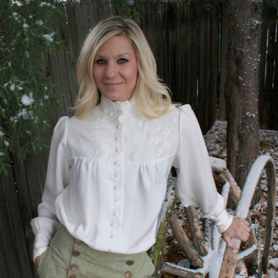 Elegant Victorian Laura Blouse in white silk with ruffle neckline and embroidered chiffon layers.