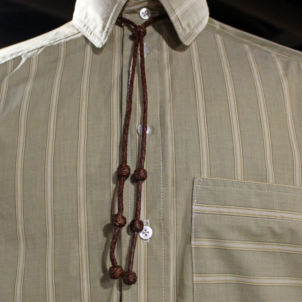 We love the look of these leather bolo ties. A simple take on the traditional bolo tie. Still dressy enough for that special even but casual in style. For men or women! Choose from Brown or Black. Measures 36" end to end.