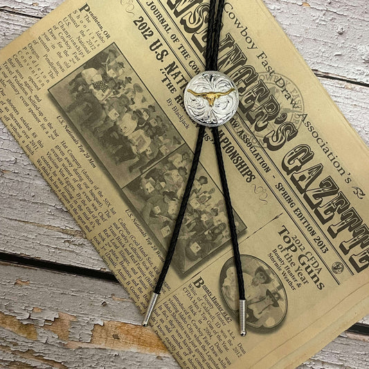This men's western bolo tie features a round silver Concho with a gold longhorn motif. Black braided leather beautifully compliments the two-toned Concho.
